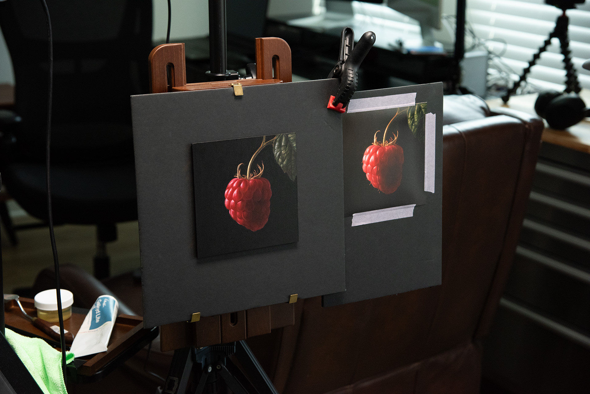 The Raspberry oil painting and its reference image side by side on George Ayers’s studio easel.